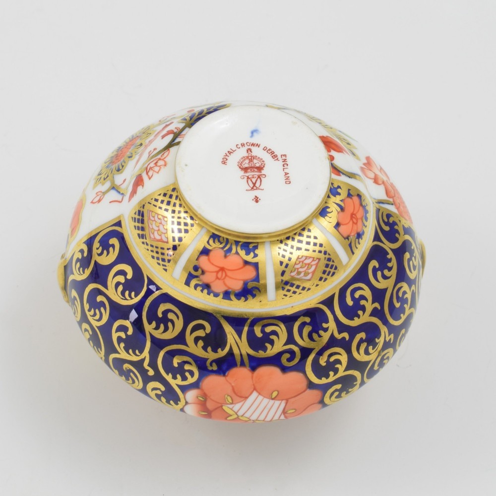 An Edwardian Royal Crown Derby miniature twin-handled porcelain vase decorated with an Imari floral pattern in cobalt blue, iron red, and gilt. View XI