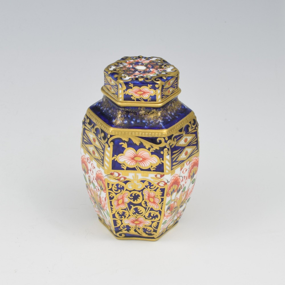 A Victorian hexagonal porcelain tea canister decorated in cobalt blue, iron red, and gilt hand-painted floral motifs with a fitted lid. View III