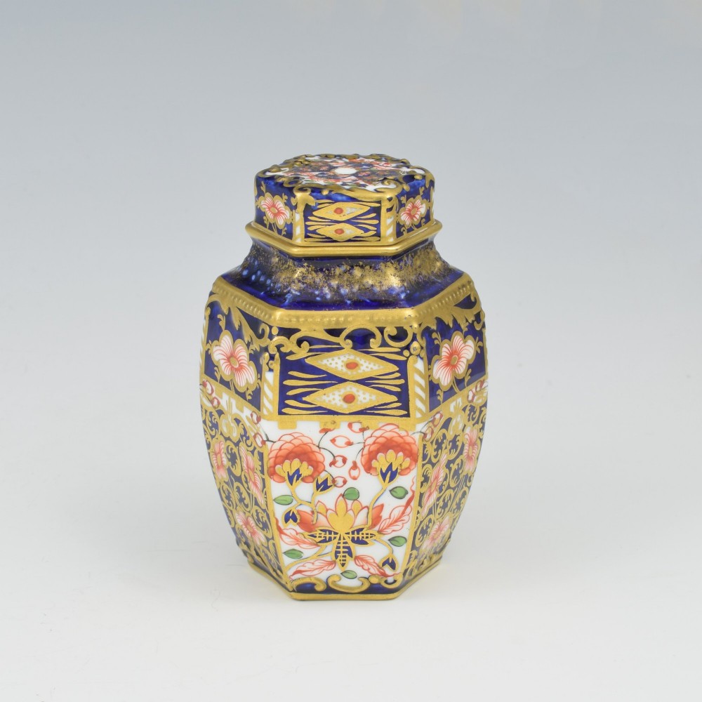 A Victorian hexagonal porcelain tea canister decorated in cobalt blue, iron red, and gilt hand-painted floral motifs with a fitted lid. View IV
