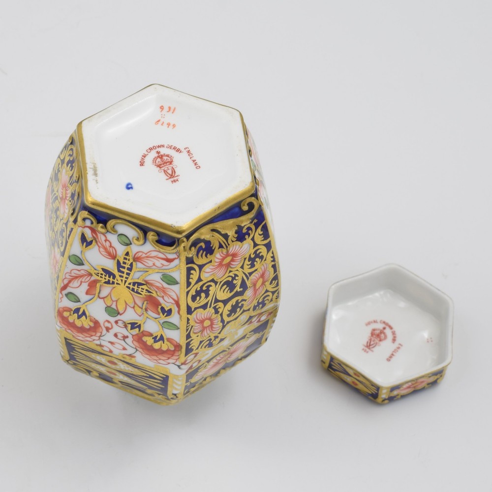 A Victorian hexagonal porcelain tea canister decorated in cobalt blue, iron red, and gilt hand-painted floral motifs with a fitted lid. View VII