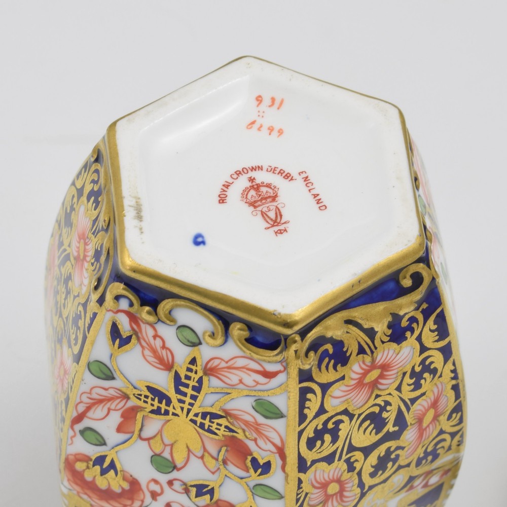A Victorian hexagonal porcelain tea canister decorated in cobalt blue, iron red, and gilt hand-painted floral motifs with a fitted lid. View VIII