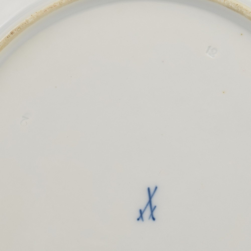 A circular white porcelain dish painted with detailed birds perched on a branch surrounded by small insects and framed by a blue foliate border. View VII