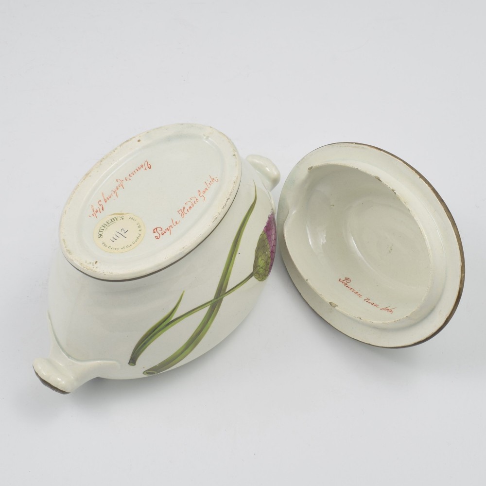 A Georgian cream pearlware lidded sauce tureen hand painted with botanical flowers and featuring scroll handles and a scroll finial. View XIII