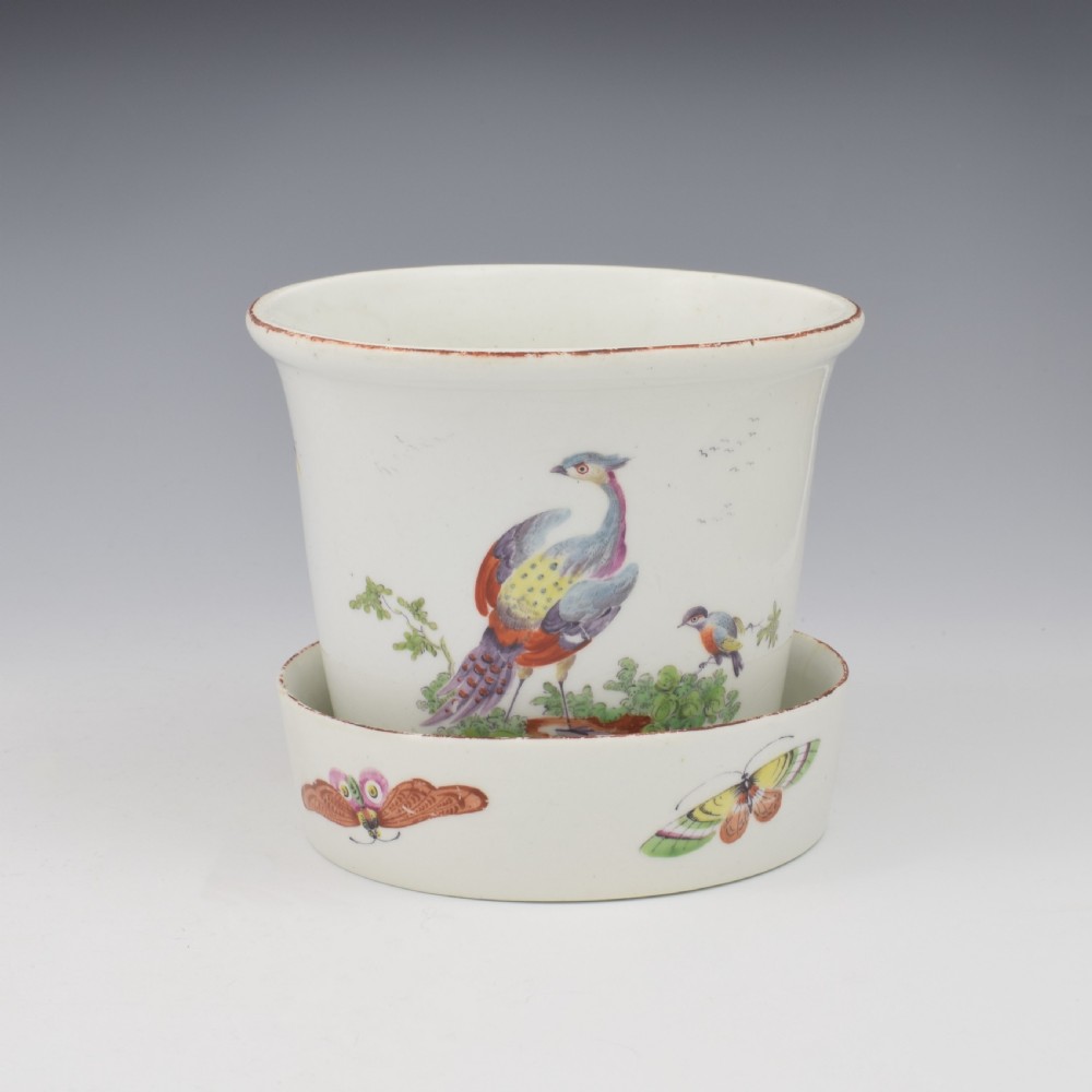 An eighteenth-century white soft-paste porcelain flower pot and matching shallow stand, decorated with hand-painted polychrome birds and insects. View III