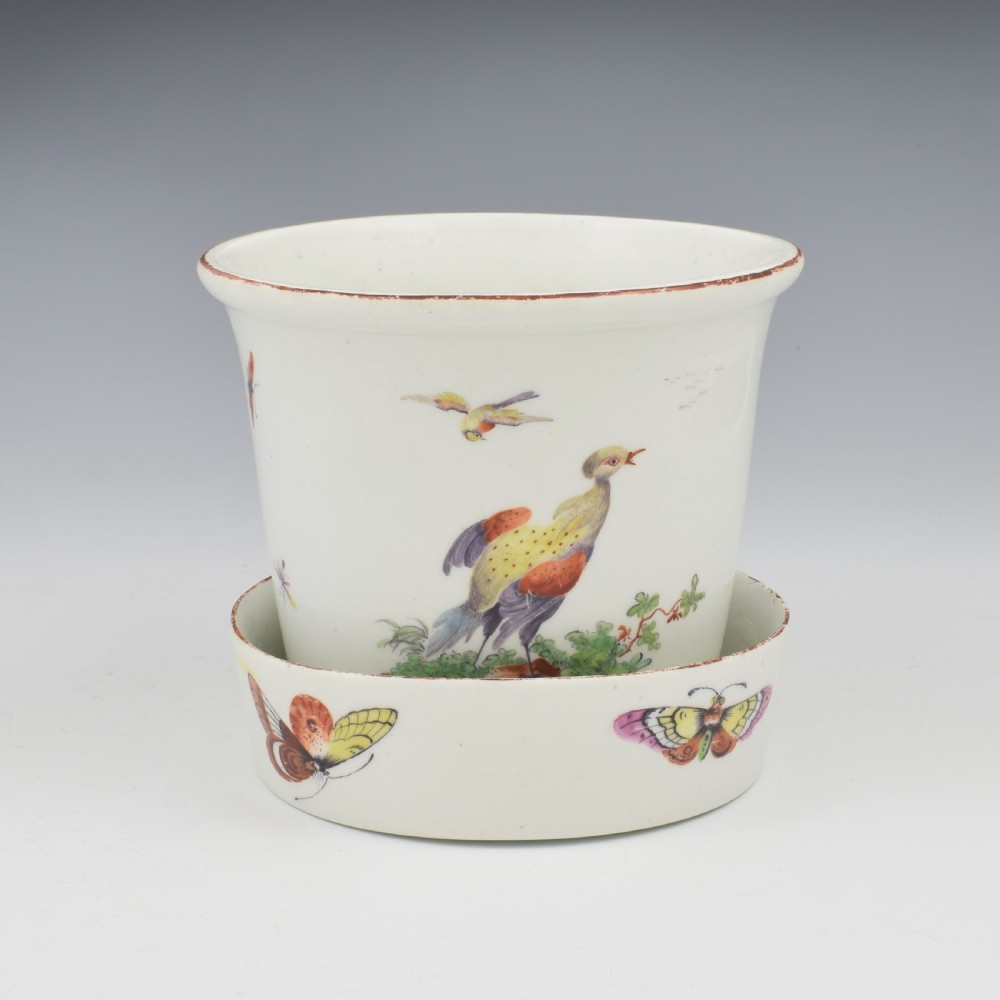 An eighteenth-century white soft-paste porcelain flower pot and matching shallow stand, decorated with hand-painted polychrome birds and insects. View IV