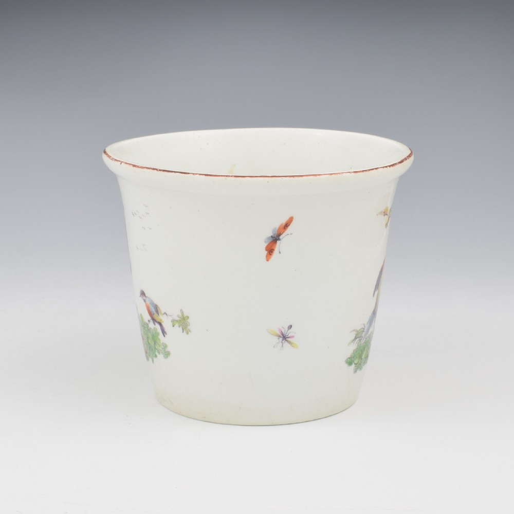 An eighteenth-century white soft-paste porcelain flower pot and matching shallow stand, decorated with hand-painted polychrome birds and insects. View V