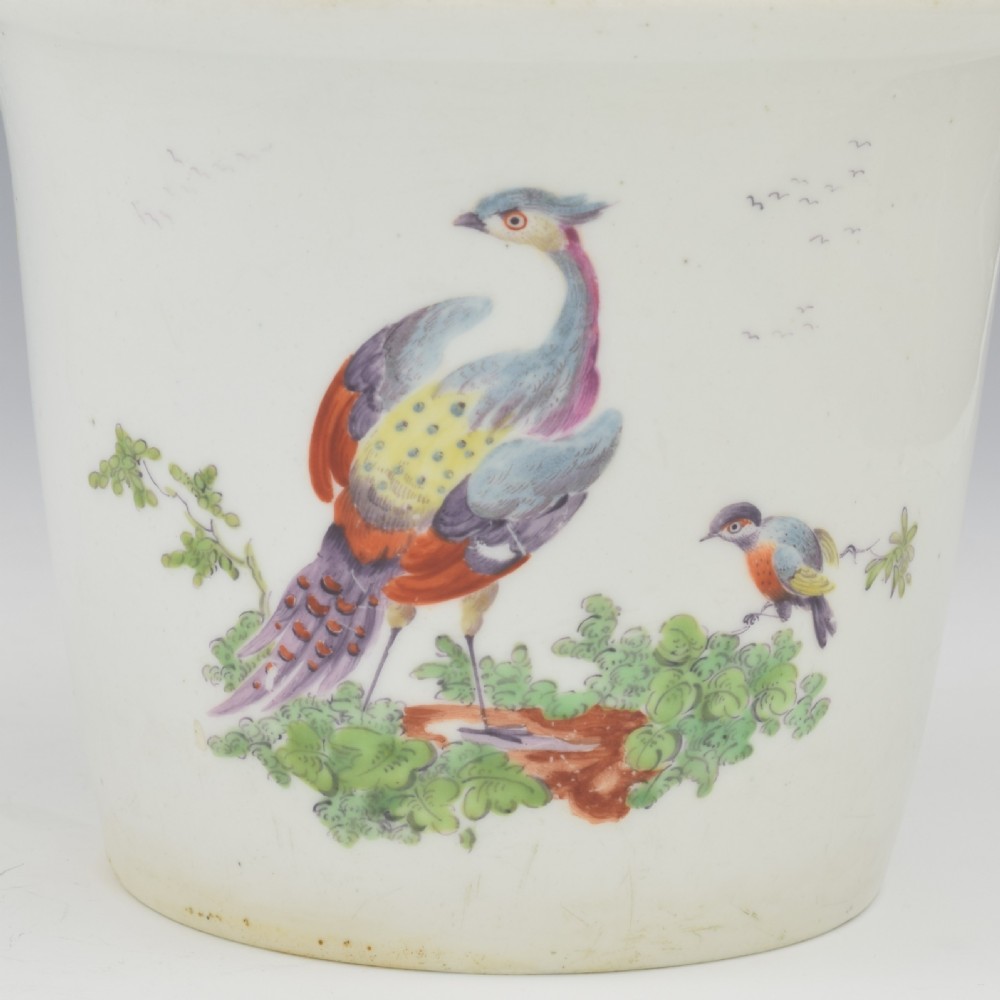 An eighteenth-century white soft-paste porcelain flower pot and matching shallow stand, decorated with hand-painted polychrome birds and insects. View VIII