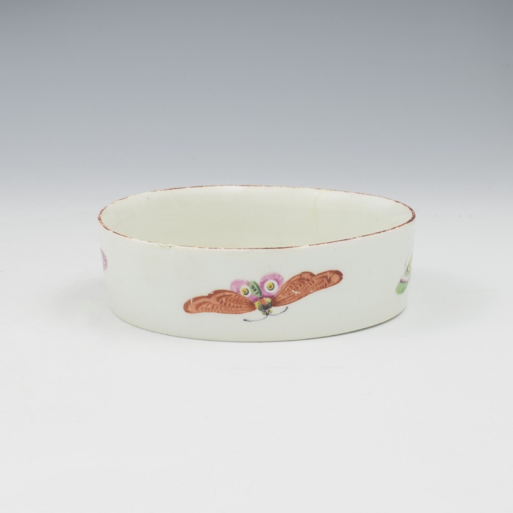 An eighteenth-century white soft-paste porcelain flower pot and matching shallow stand, decorated with hand-painted polychrome birds and insects. View XIII
