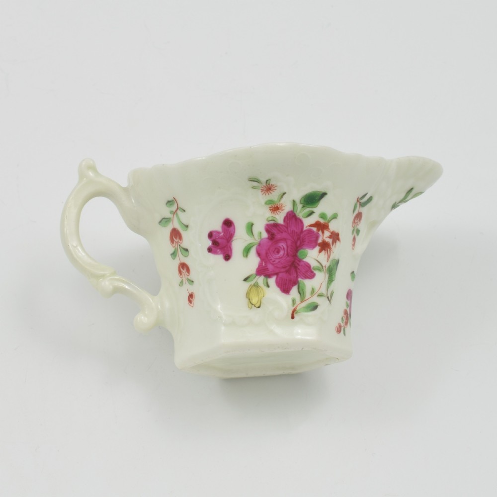 An 18th-century soft-paste porcelain hexagonal sauce boat featuring hand-painted pink floral sprays and a molded scroll handle. View XIII