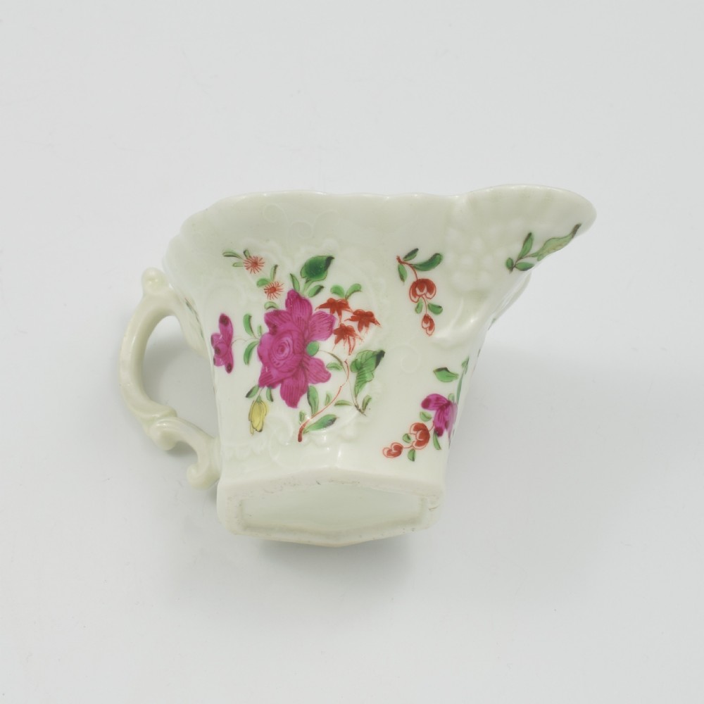 An 18th-century soft-paste porcelain hexagonal sauce boat featuring hand-painted pink floral sprays and a molded scroll handle. View XIV
