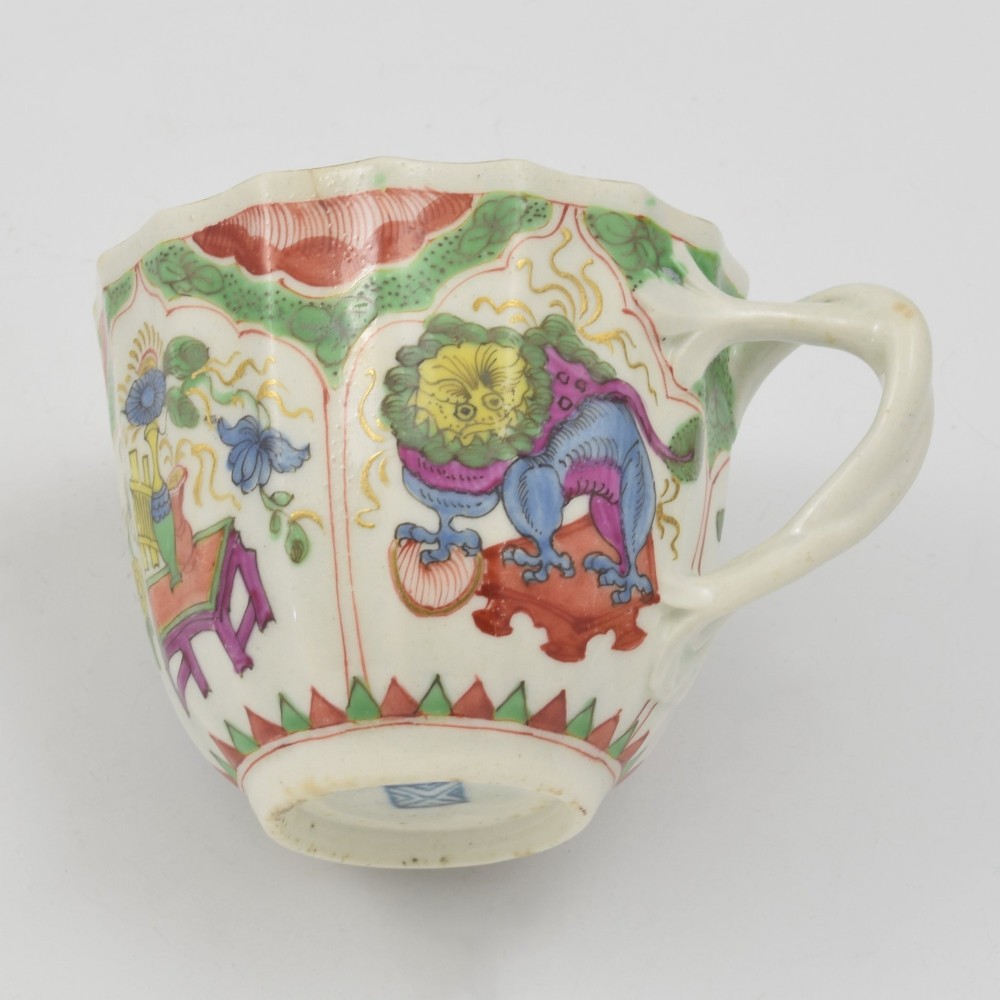 An 18th-century fluted soft-paste porcelain coffee cup with hand-painted Chinoiserie dragon motifs and a looped handle. View VIII