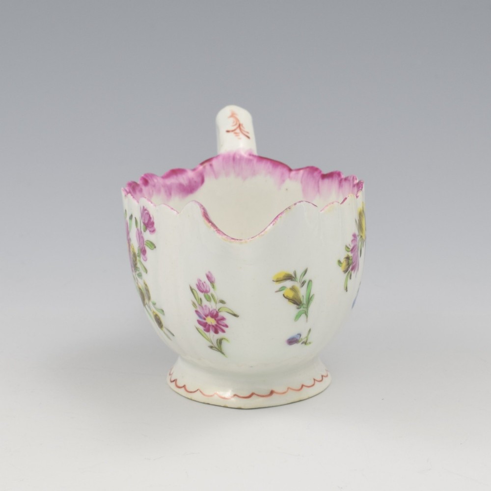 An eighteenth-century Bow soft-paste porcelain fluted sauce boat with hand-painted floral sprigs and a magenta feathered rim. View IV