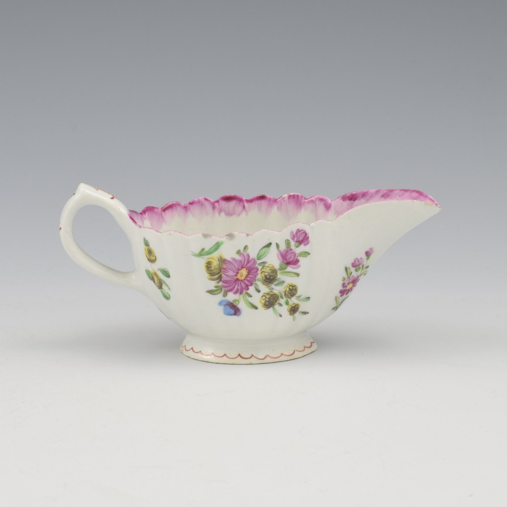 An eighteenth-century Bow soft-paste porcelain fluted sauce boat with hand-painted floral sprigs and a magenta feathered rim. View VI