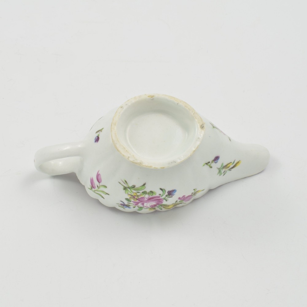 An eighteenth-century Bow soft-paste porcelain fluted sauce boat with hand-painted floral sprigs and a magenta feathered rim. View XI