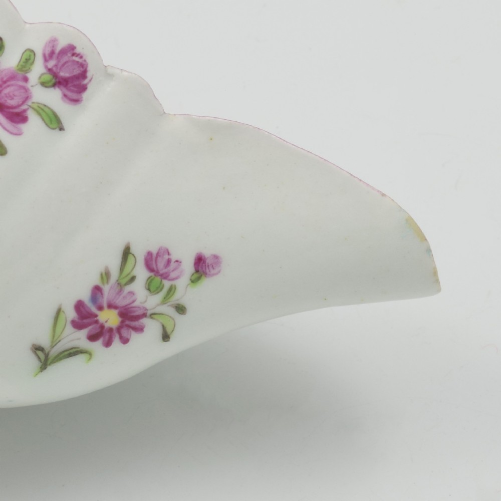 An eighteenth-century Bow soft-paste porcelain fluted sauce boat with hand-painted floral sprigs and a magenta feathered rim. View XIV