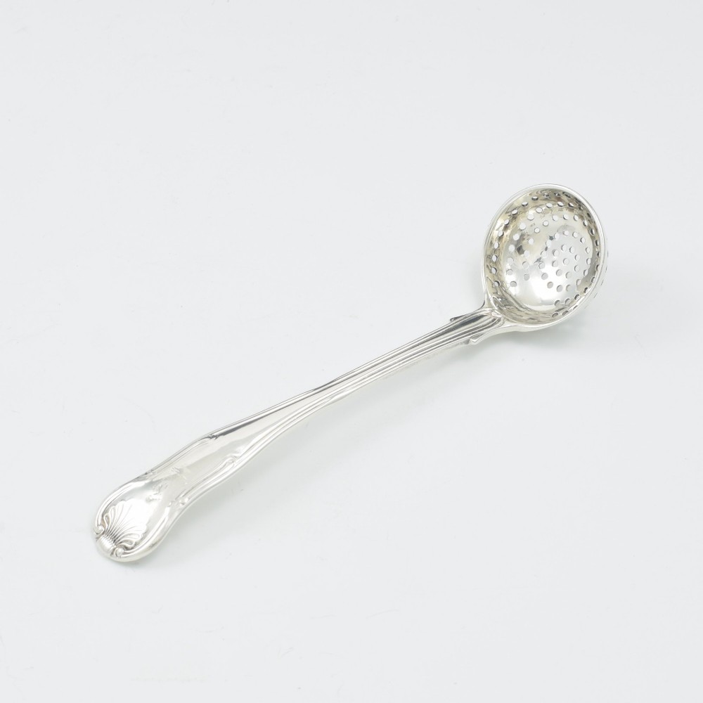A Georgian sterling silver sifter spoon featuring a circular pierced bowl and a Kings Hourglass pattern handle. View II