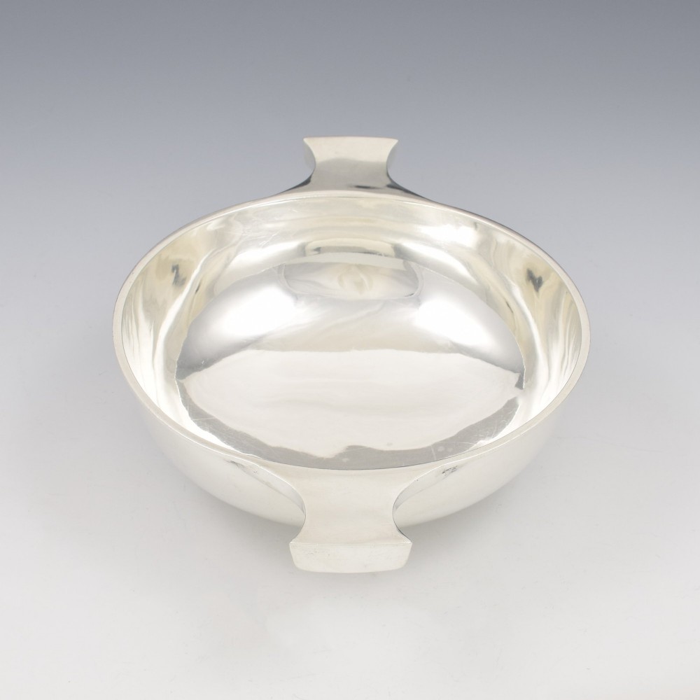 A circular Edwardian sterling silver quaich with a plain polished interior and two flat side handles. View VI