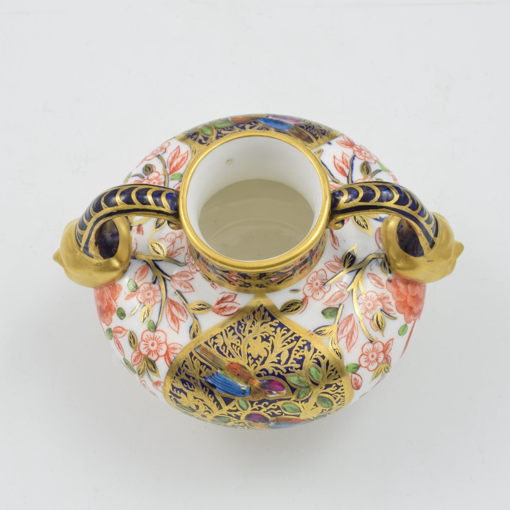 A Victorian Royal Crown Derby porcelain vase featuring twin gilded mask handles, intricate cobalt blue and gold panel decoration, and hand-painted floral motifs. View XIII