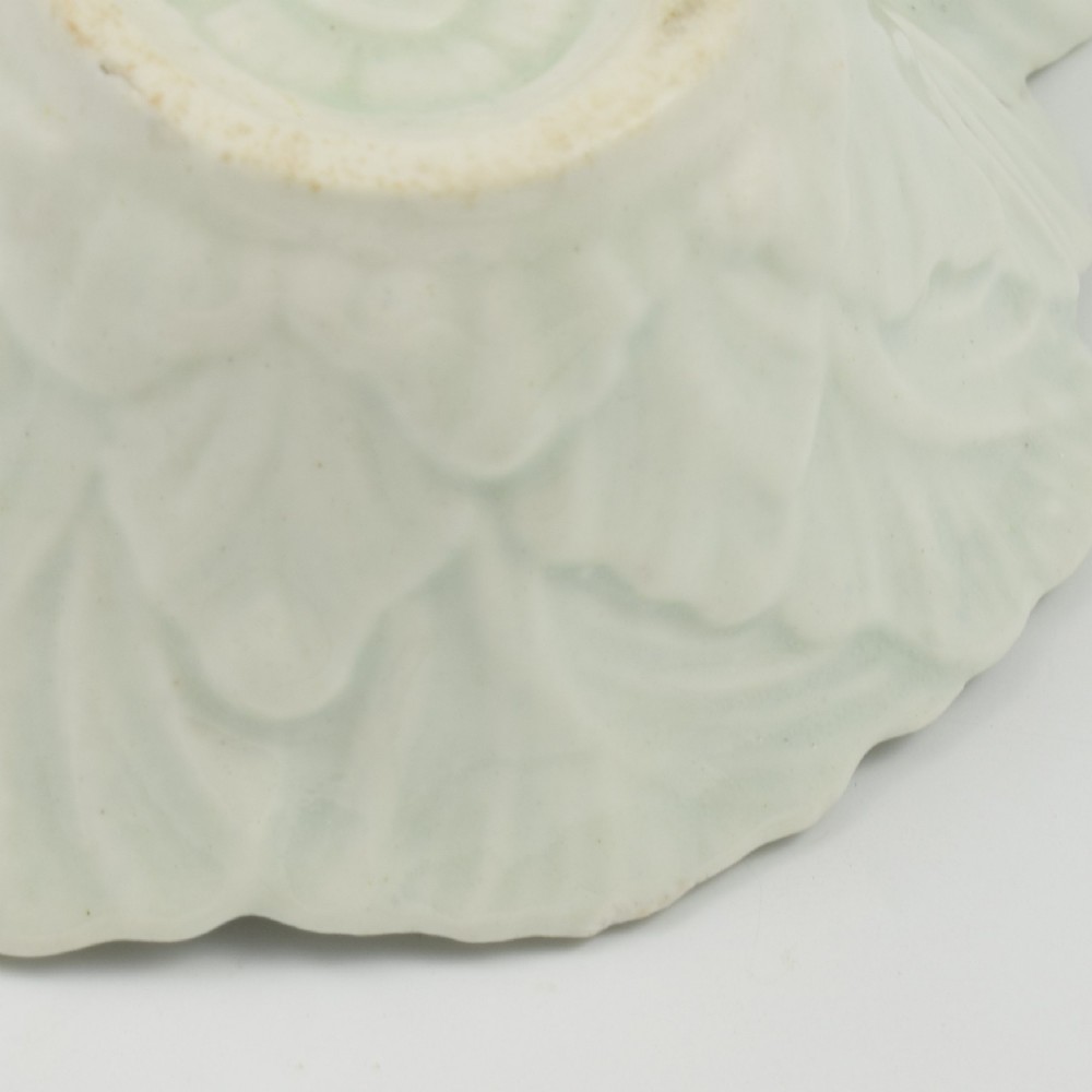 A leaf-shaped soft-paste porcelain butter boat decorated with an underglaze blue hand-painted rose motif and a floral running border. View XII