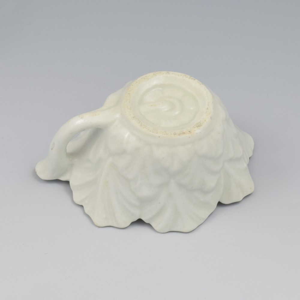 An eighteenth-century Dr Wall First Period Worcester soft-paste porcelain butter boat featuring hand-painted polychrome floral enamel sprigs and a leaf-moulded rim. View XIII