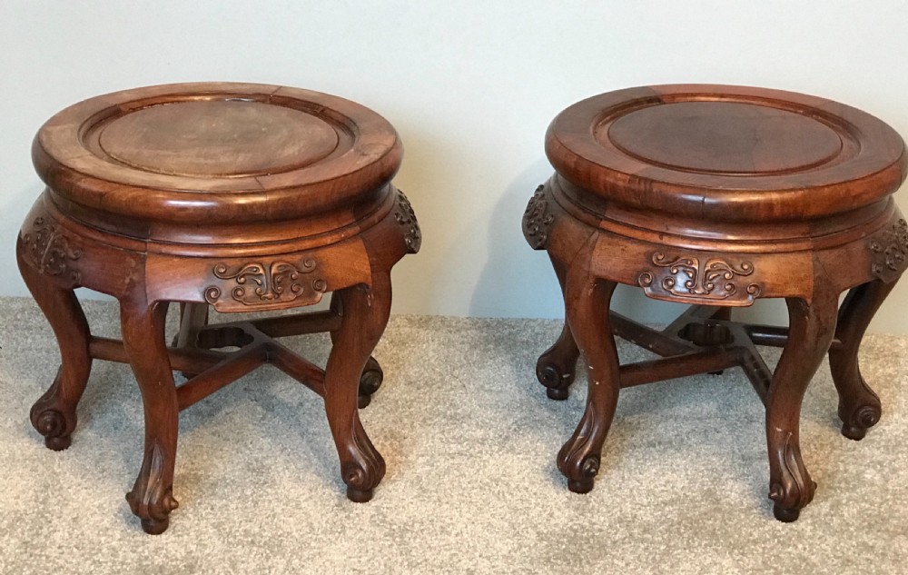  A pair of oriental hardwood Jardiniere stands 