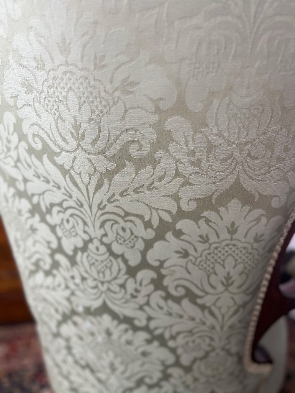 A pair of late Victorian carved mahogany salon armchairs upholstered in light green damask fabric featuring cabriole legs and scroll arms. View IX