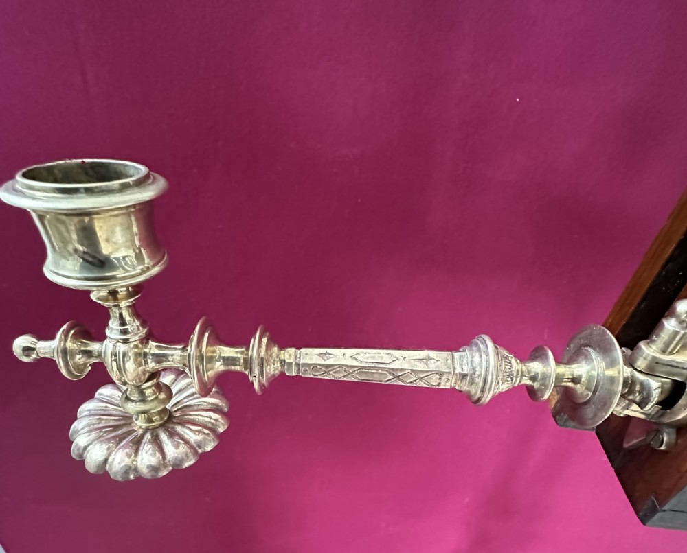 An antique burr walnut music stand featuring a carved lyre motif, adjustable brass stem, side candle sconces, and turned pedestal tripod base. View II