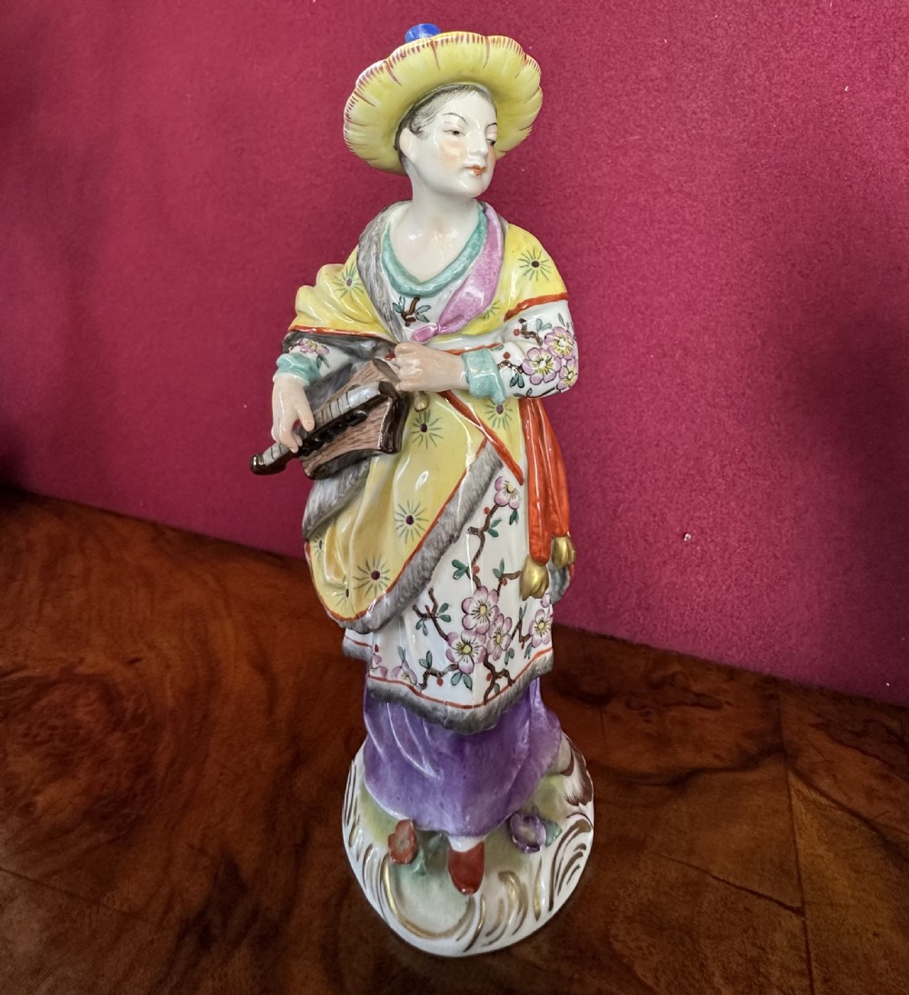 Porcelain china figures of oriental musicians. View II
