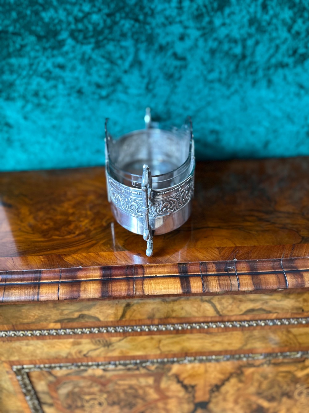 An oblong silver-plated Art Nouveau centrepiece bowl featuring ornate twin handles, relief scrollwork, a central cartouche, and a clear glass liner. View III