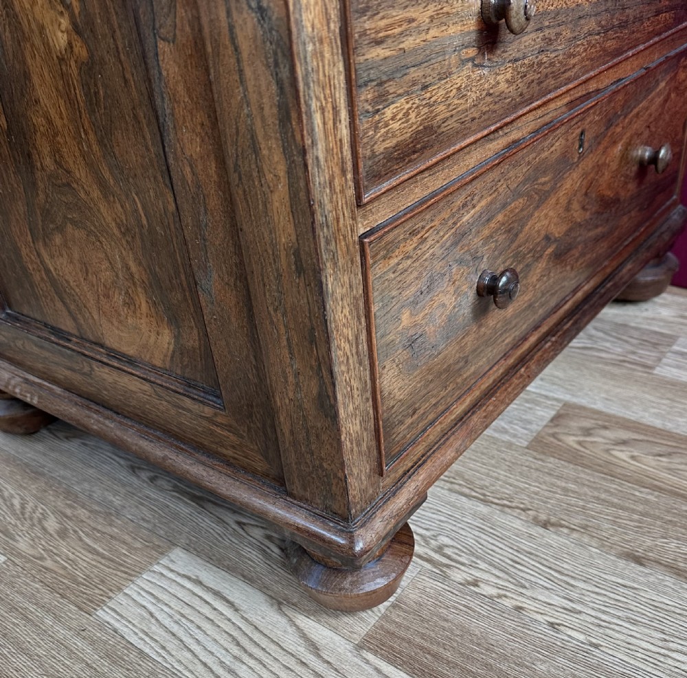 A Regency rosewood Davenport desk featuring a sloped leather writing surface, a brass gallery railing, and pull-out side drawers. View IX