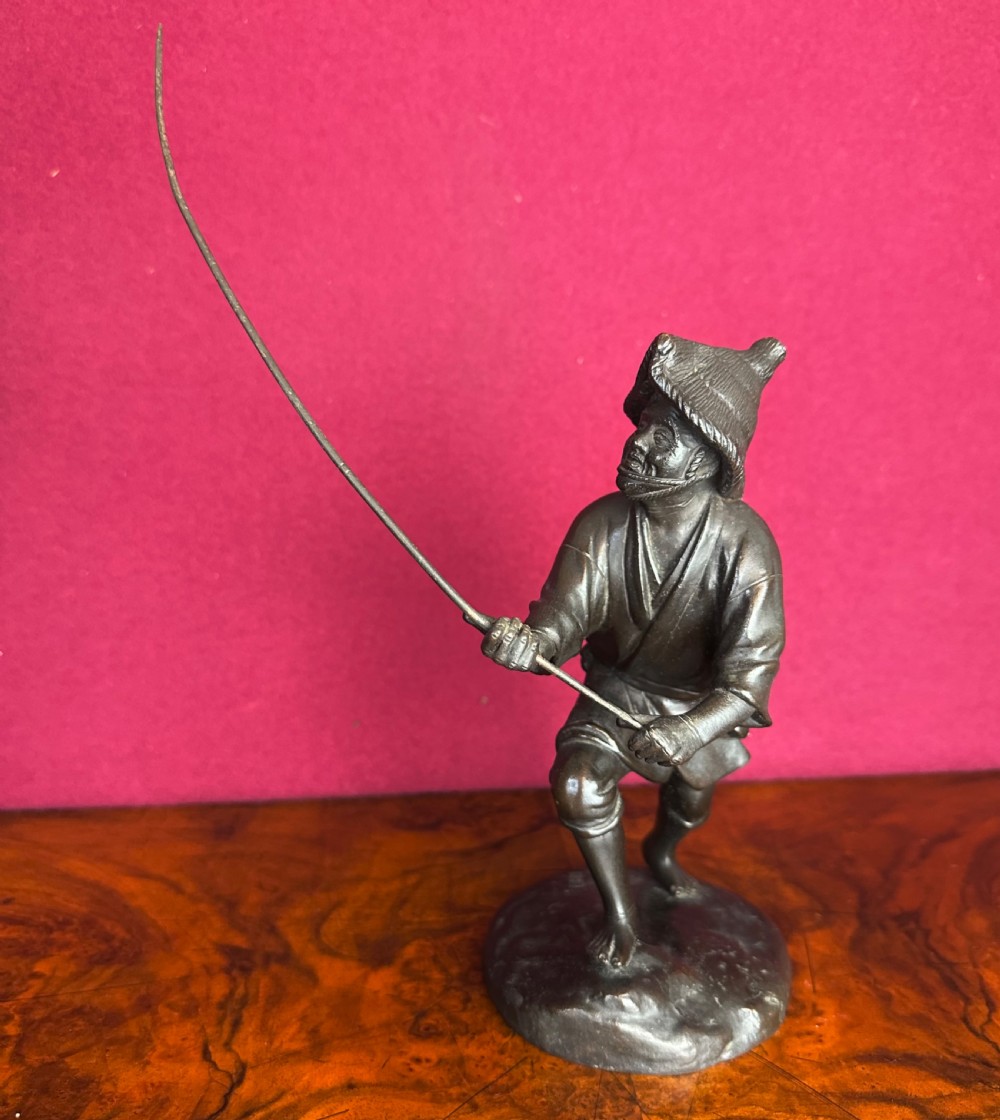 Bronze figure of a Japanese fisherman circa 1890. Japanese bronze..