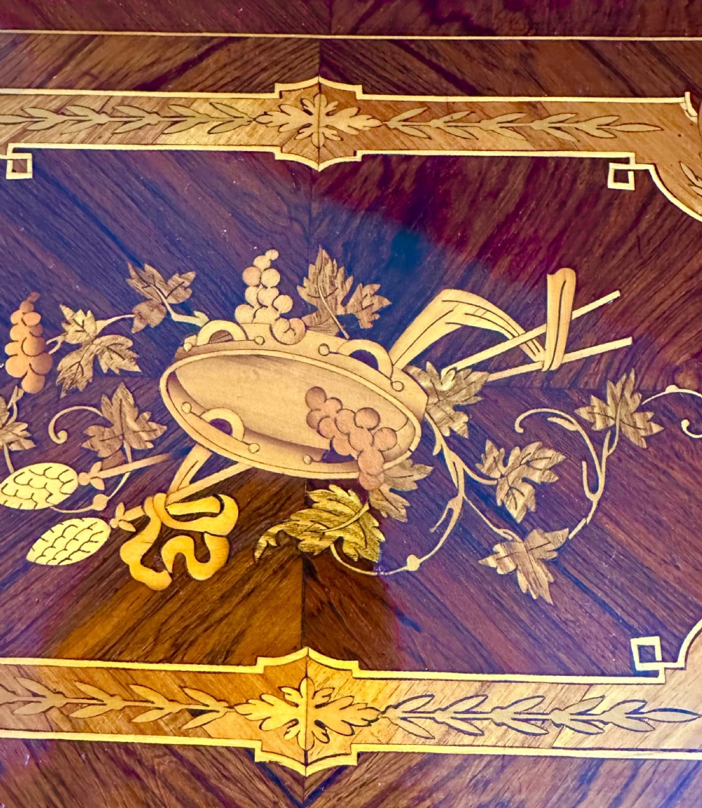 A late nineteenth-century French style marquetry side table featuring floral inlays, a pierced brass gallery top, turned legs, and a shaped lower stretcher. View VI
