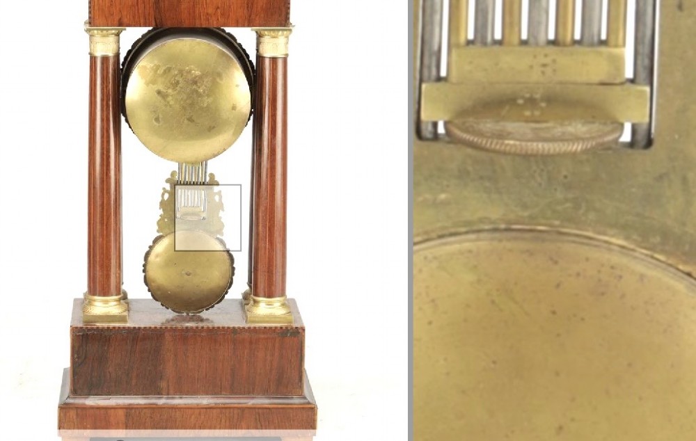A late 19th-century French portico mantel clock crafted from dark wood with floral marquetry inlays, featuring twin columns and a decorative brass pendulum. View VI