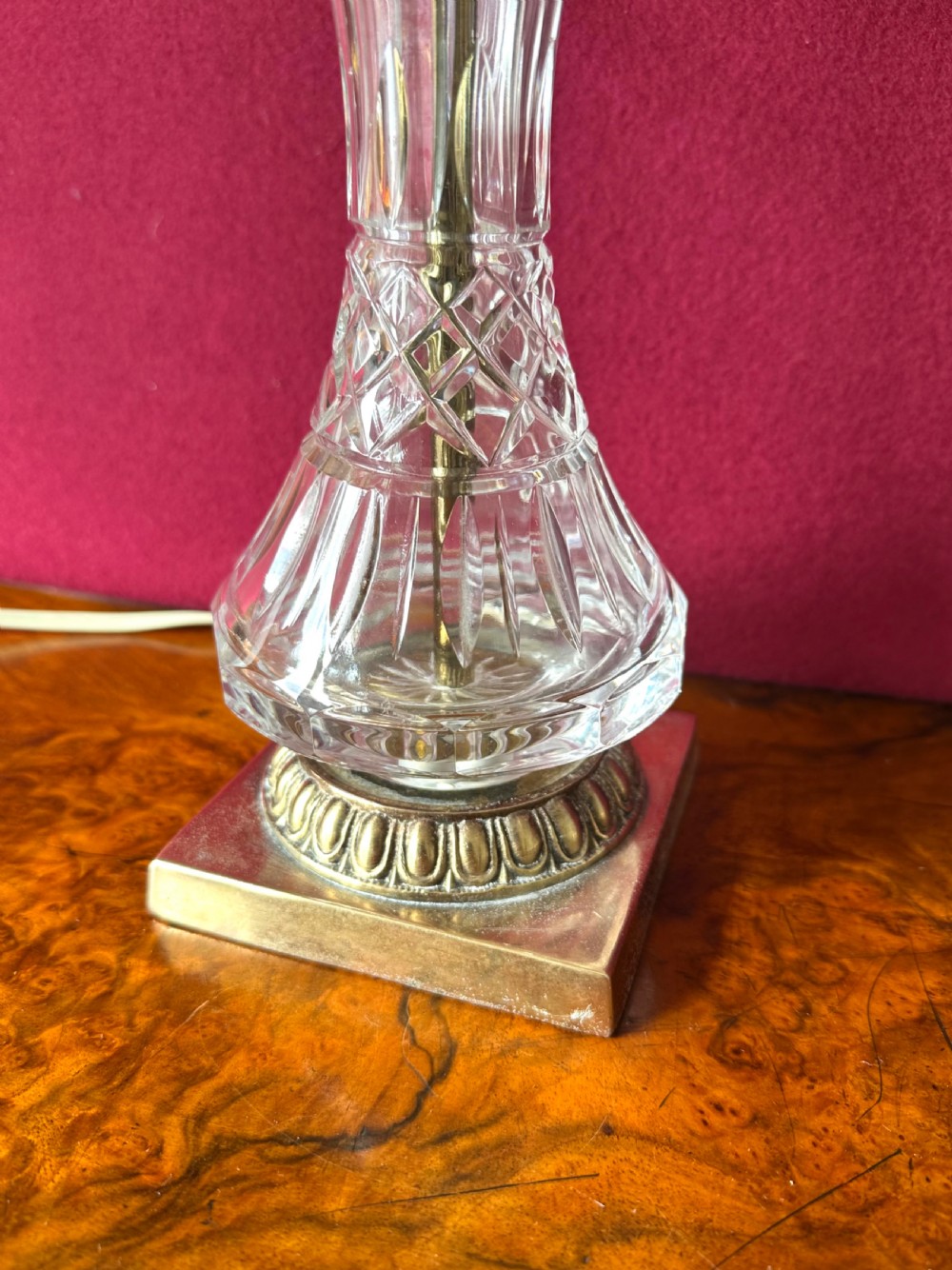 A pair of matching cut crystal table lamps featuring dome shades, faceted baluster stems, square metal bases, and pointed finials. View III