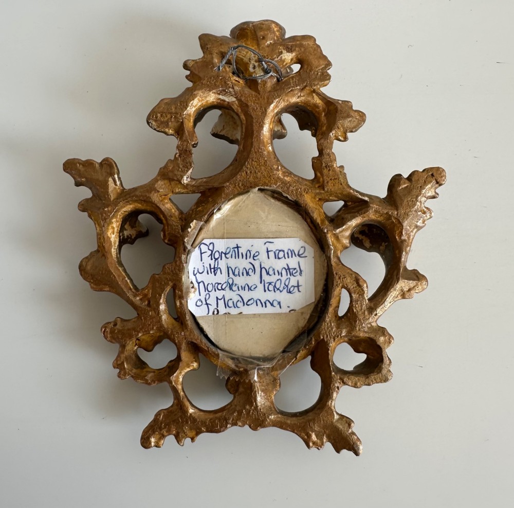 A small Victorian oval miniature portrait of the Madonna in a blue veil, set within a gilt metal scrollwork frame. View II