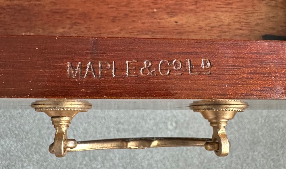 An Edwardian mahogany cylinder bureau featuring floral marquetry inlay on the curved front, brass handles, square tapered legs, and crossbanded borders. View XIV