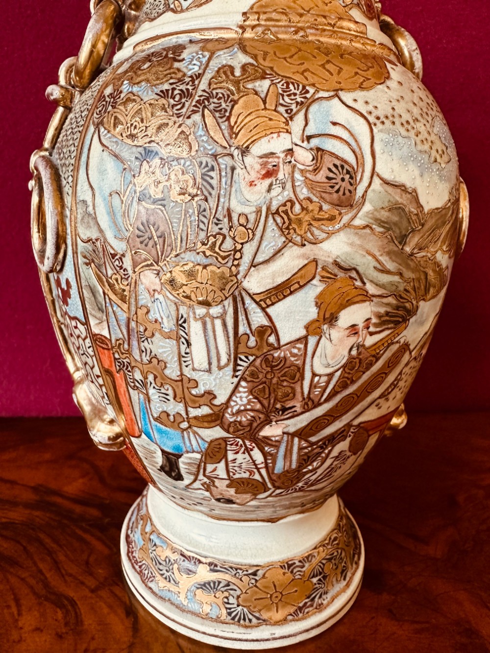 A Japanese Satsuma earthenware vase with crackle glaze, detailed polychrome figures, and heavy gold enamelling. View II
