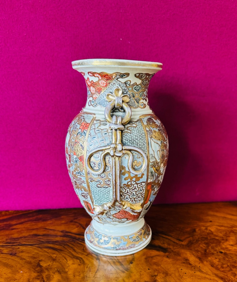 A Japanese Satsuma earthenware vase with crackle glaze, detailed polychrome figures, and heavy gold enamelling. View III
