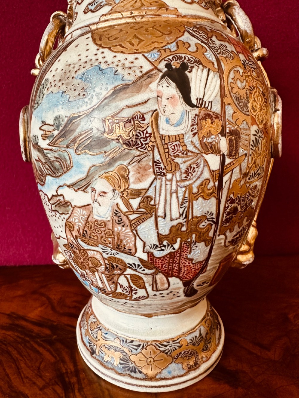 A Japanese Satsuma earthenware vase with crackle glaze, detailed polychrome figures, and heavy gold enamelling. View IV