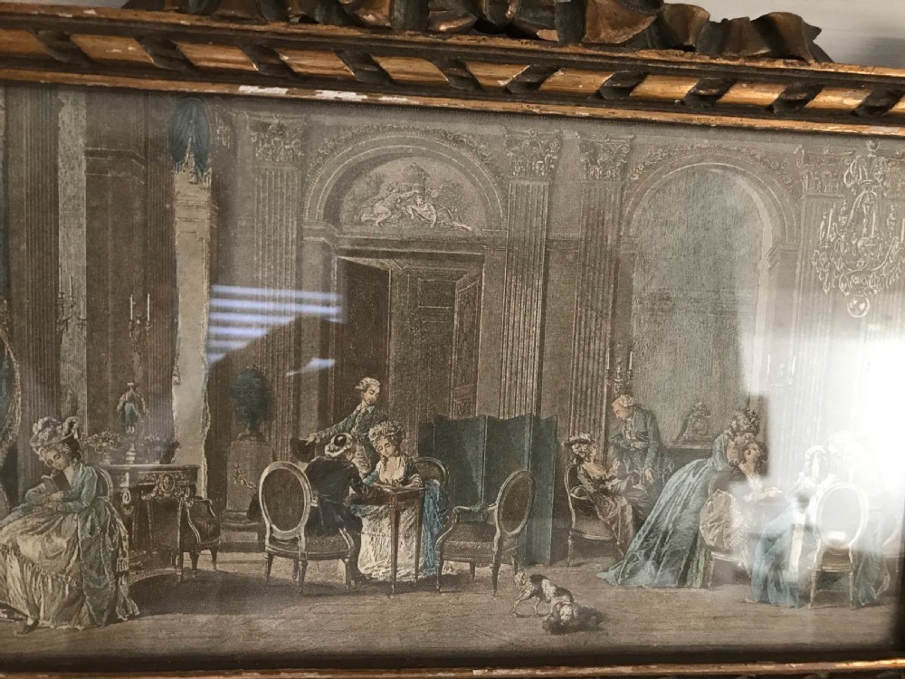 A rectangular French gilded easel mirror featuring a carved twist border, a top panel depicting a period scene, and mirror glass below. View V