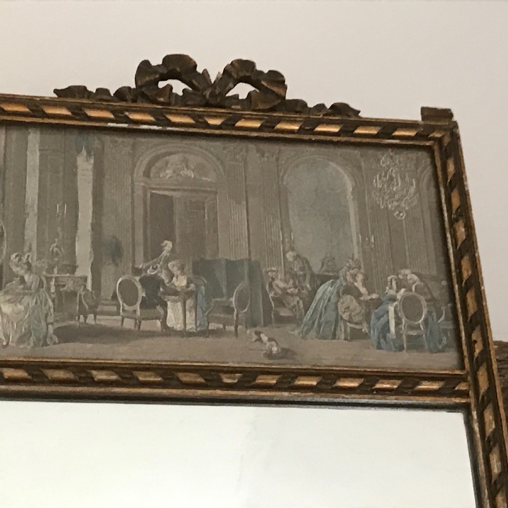A rectangular French gilded easel mirror featuring a carved twist border, a top panel depicting a period scene, and mirror glass below. View VI