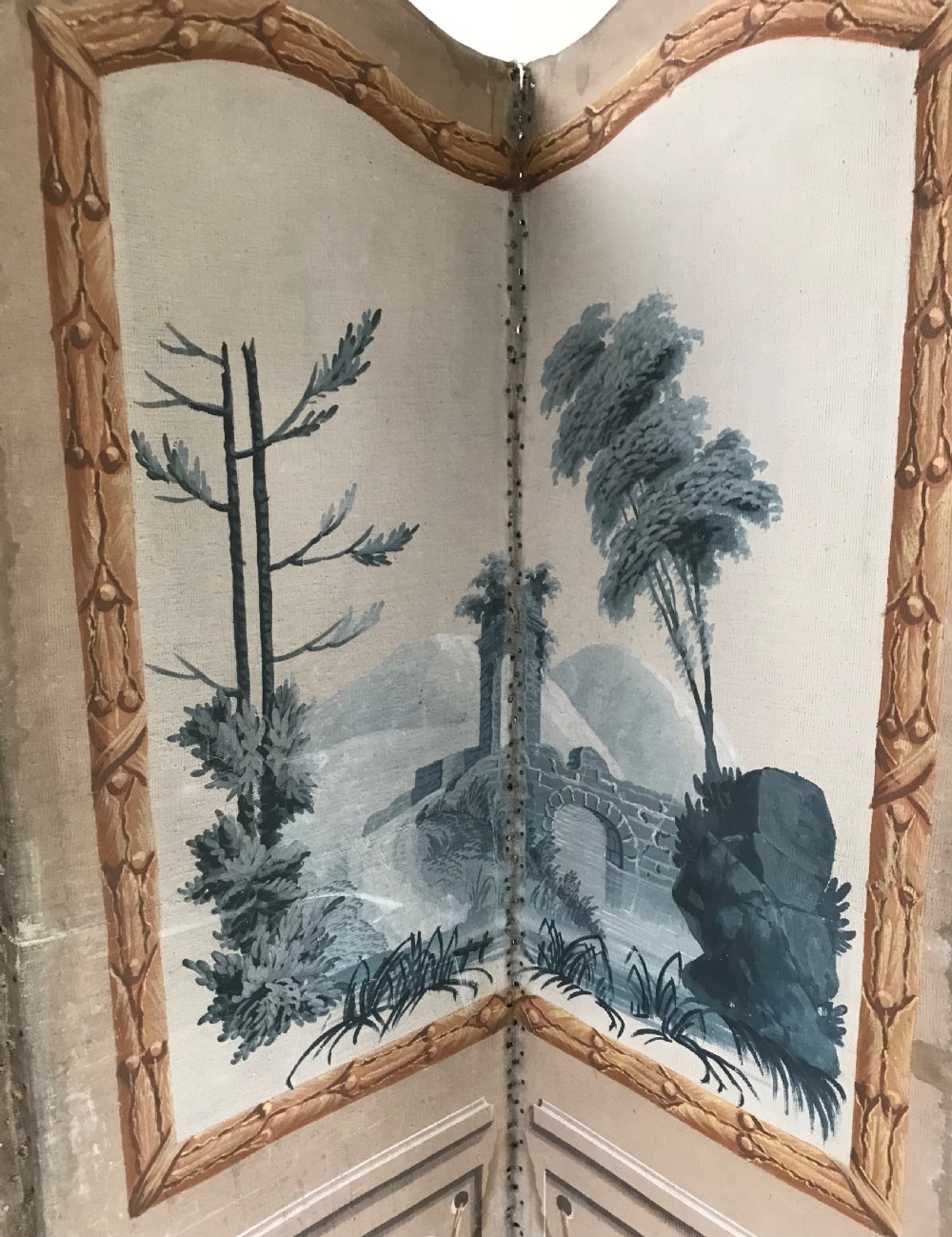 A four-panel French folding screen featuring hand-painted monochrome landscape scenes above simulated wooden wall panelling. View VIII