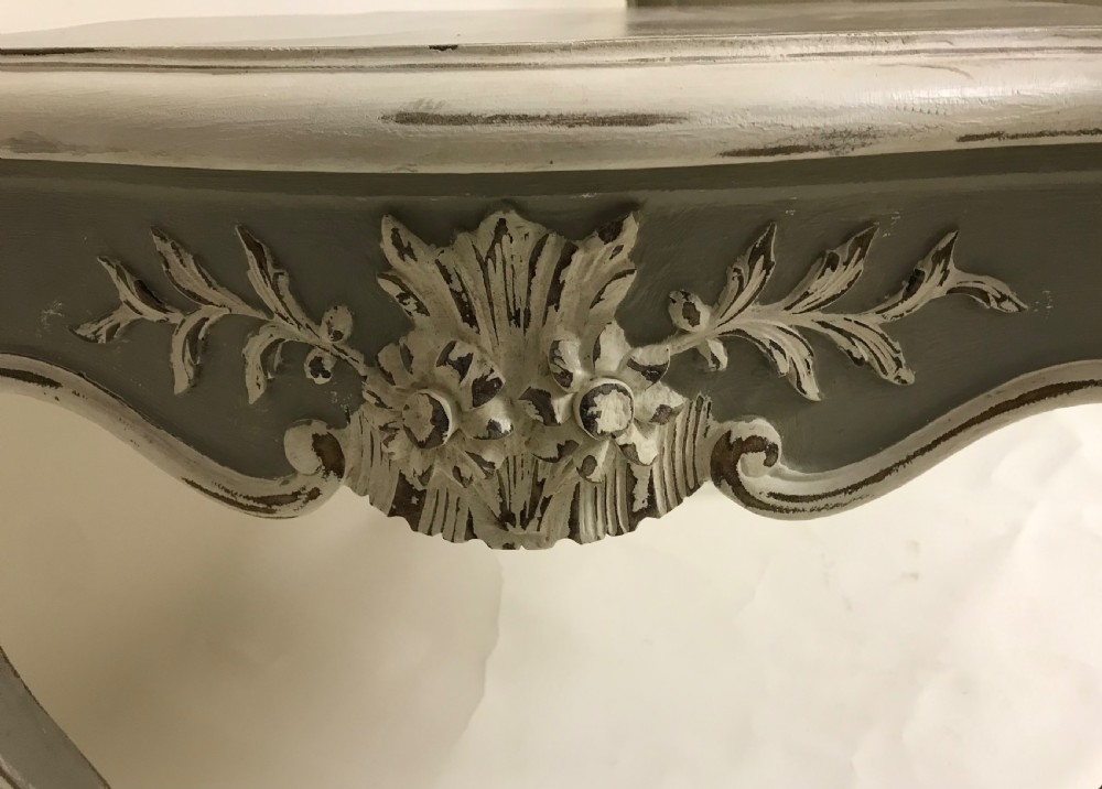 A grey painted French Rococo style side table featuring carved white foliate accents and slender cabriole legs. View V