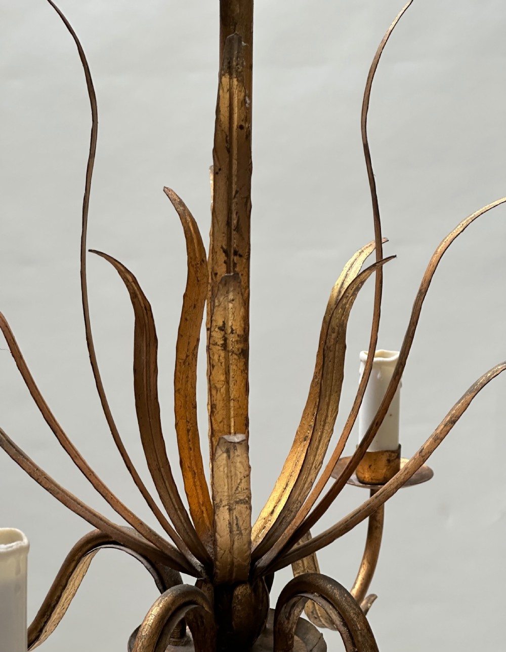 A French gilded metal chandelier featuring central vertical foliage leaves and three curved candle arms. View II