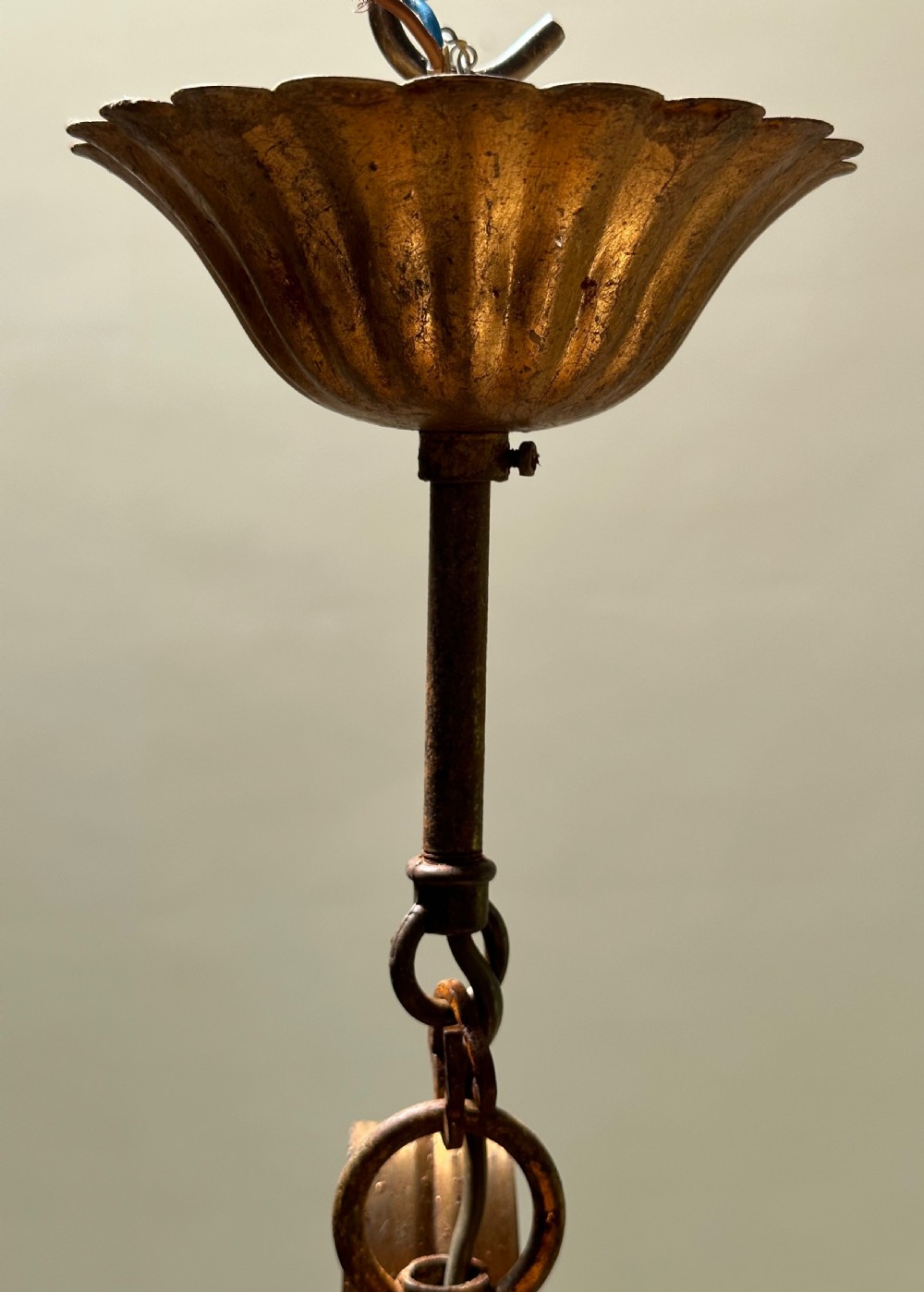 A French gilt metal multi-arm ceiling chandelier featuring sculptured flower petals, leaf motifs, and six candle-style light sockets. View IX