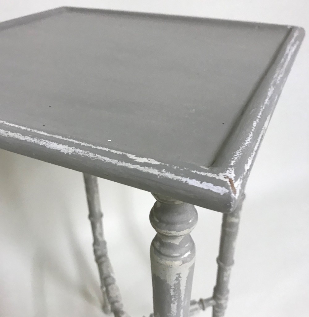 A tall light grey painted wooden side table featuring faux bamboo turned legs and a central X-frame stretcher. View VI