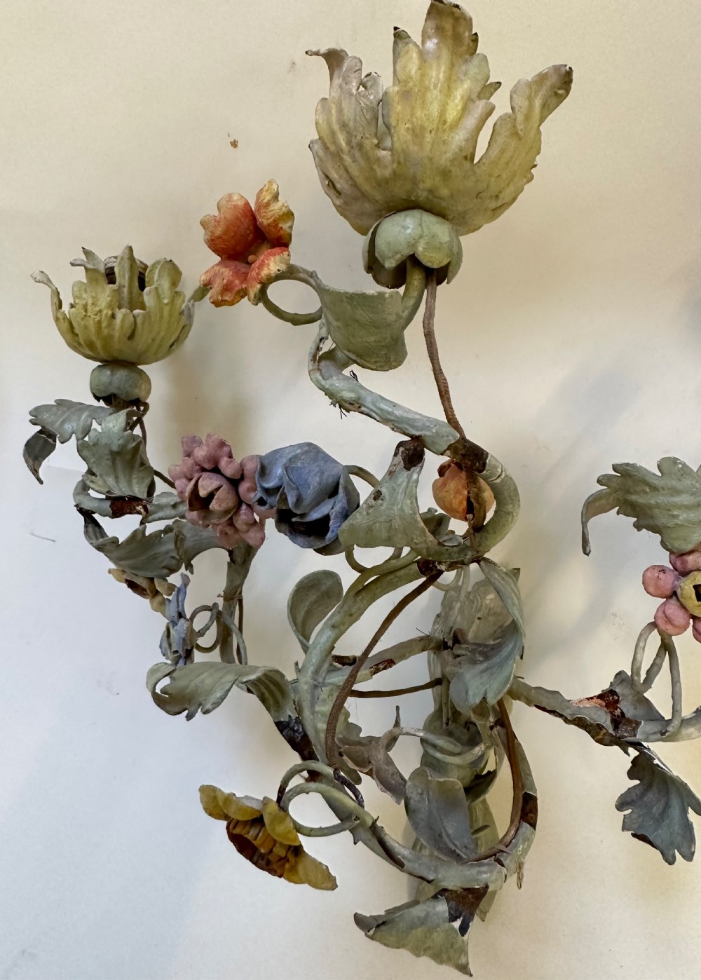 A pair of French floral wall sconces constructed from painted metal with branching foliate arms and colourful tulip-shaped sockets. View III