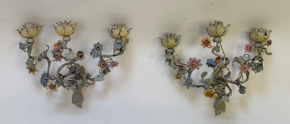 A pair of French floral wall sconces constructed from painted metal with branching foliate arms and colourful tulip-shaped sockets. View VI