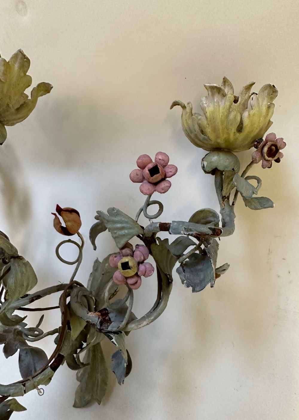 A pair of French floral wall sconces constructed from painted metal with branching foliate arms and colourful tulip-shaped sockets. View VII