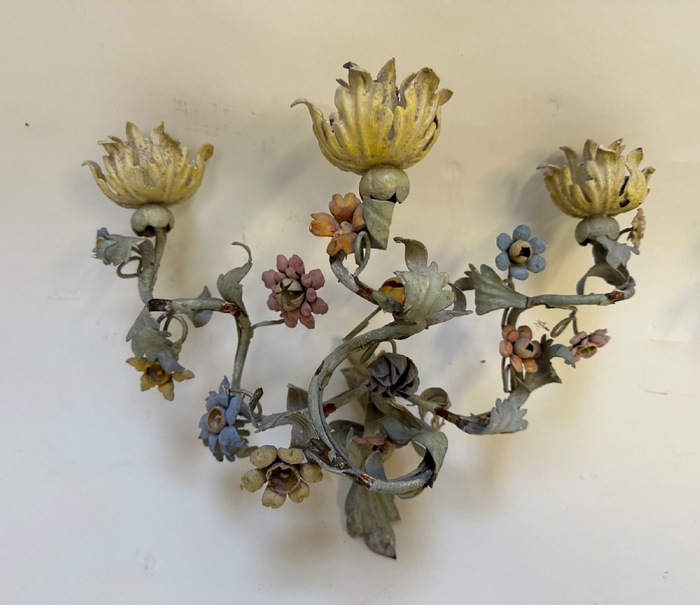 A pair of French floral wall sconces constructed from painted metal with branching foliate arms and colourful tulip-shaped sockets. View VIII